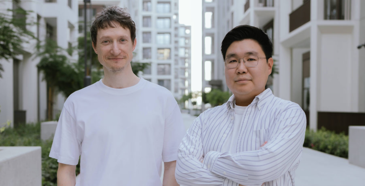 Symbiotic founders standing outdoors